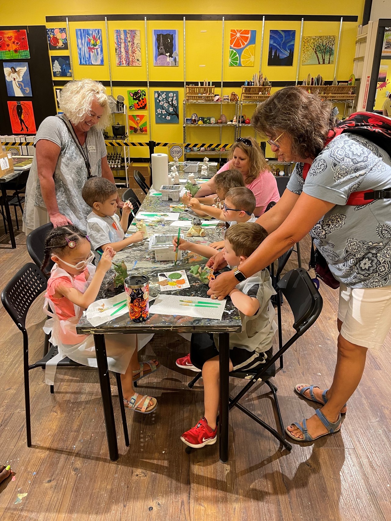 TCESC Preschoolers paint ceramic frogs during their field trip to the Eastwood Mall